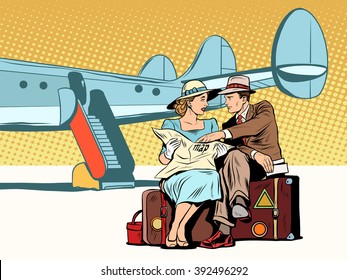 Tourists couple looking at the map, after landing
