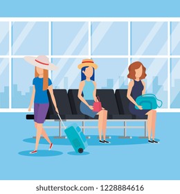 tourists girls with suitcases in the airport