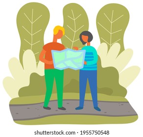 Tourists are looking for way to their destination during hike. Travelers get lost in forest with map