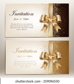 tow pretty wedding invitation with golden ribbon and bow.