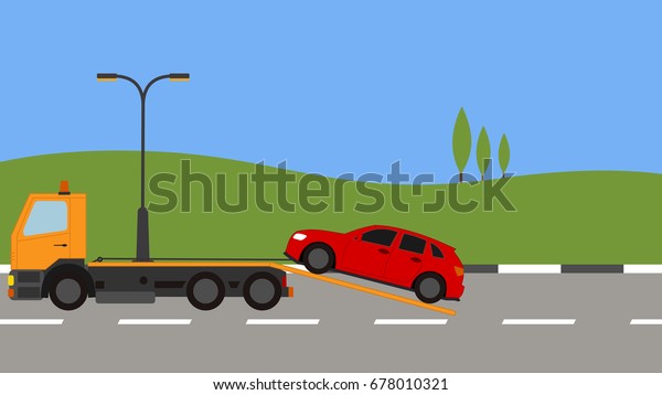 Tow truck picking up a car\
in town