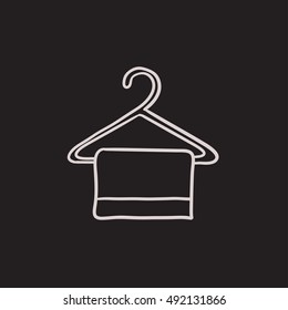 Toalla sobre el icono de boceto del vector del colgador aislado en el fondo. Toalla dibujada a mano sobre el icono de la percha. Icono de esbozo de toalla sobre percha para infografía, sitio web o aplicación.