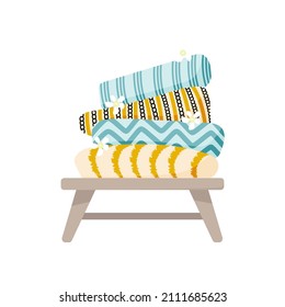 Towels on bench isolated illustration. Colorful vector.