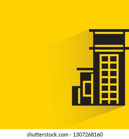 tower building with drop shadow on yellow background vector