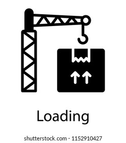 
A tower crane lifting heavy package for delivery, showing cargo process  
