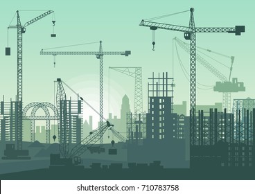 Tower cranes on construction site. Buildings under construction.