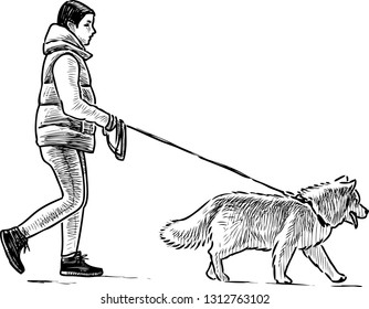 A townswoman strolls with her dog