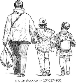 A townswoman with two little girl going from a school