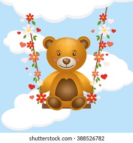 toy bear cub on a swing
