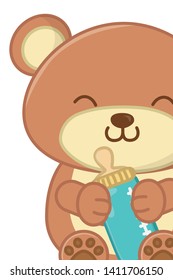 toy bear holding a feeding bottle close up