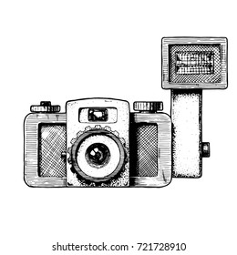 Toy camera with attached flash. Vector hand drawn sketch of retro photocamera in vintage engraved style on white background.