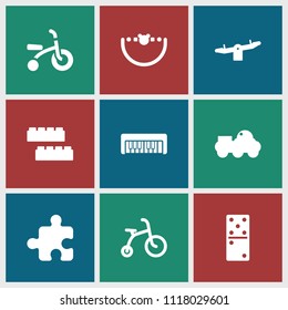 Toy icon. collection of 9 toy filled icons such as child bicycle, child building kit, swing, robot, domino. editable toy icons for web and mobile.