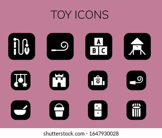 toy icon set. 12 filled toy icons.  Simple modern icons such as: Toy, Crib Baby food, Party blower, Sand castle, Sand bucket, Baby bag, Dominoes, Playground, Party whistle