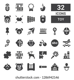 toy icon set. Collection of 32 filled toy icons included Pacifier, Shrine remembrance, Collar, Cradle, Bear, Baby boy, Toy, Rattle, Puzzle, Dog, Robot, Baby walker, Abc, Tricycle