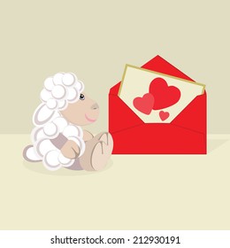 Toy sheep with post card and envelope.