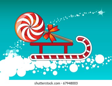 Toy sled driven by lollipop round, tied with a bow.