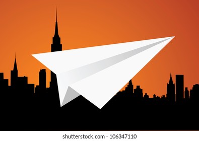 Toy. The white paper plane and large city