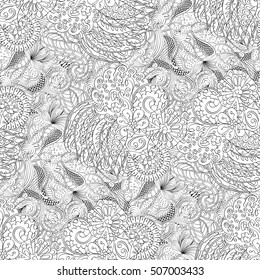 Tracery seamless calming pattern. Mehndi design. Ethnic monochrome binary doodle texture. Curved doodling black and white background. Vector.