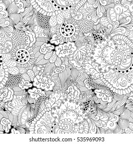 Tracery seamless calming pattern. Mehndi design. Ethnic monochrome binary doodle texture. Curved doodling black and white background. Vector.