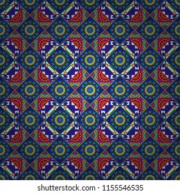 Tracery seamless pattern in Mehndi style. Ethnic colorful doodle texture in blue, brown and orange colors. Curved doodling background.