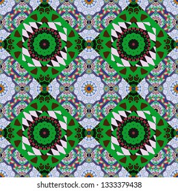 Tracery seamless pattern. Vector curved doodling background. Ethnic colorful doodle texture in green, violet and blue colors. Mehndi design.