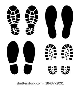 Traces of human shoes sole silhouette black. Icon or sign for printing. Flat style. Isolated on a white background. Vector illustration
