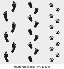 traces of man and dog on a gray background