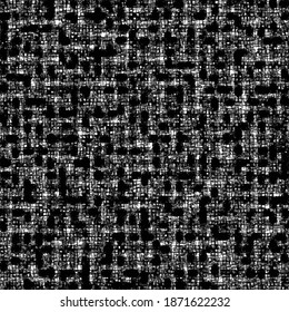 Traces of material on a mesh support. Damaged black canvas. Abstract grunge background.
