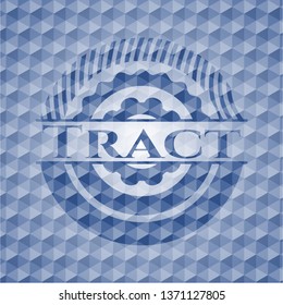 Tract blue emblem with geometric pattern.