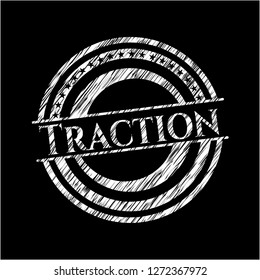 Traction chalk emblem written on a blackboard