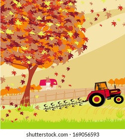 Tractor plowing field in autumn 