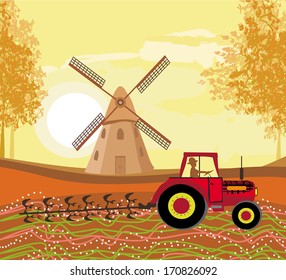 Tractor plowing field in autumn 