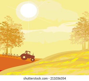 Tractor plowing field in autumn 