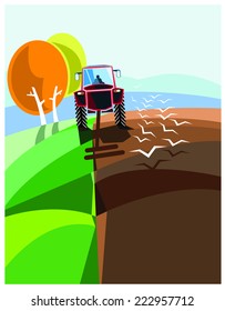 A tractor working in the field during a nice sunny day.