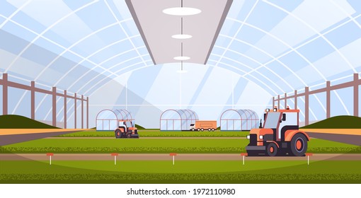 tractors working on organic products industrial plantation growing plants smart farming agribusiness concept