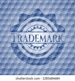 Trademark blue emblem with geometric pattern background.