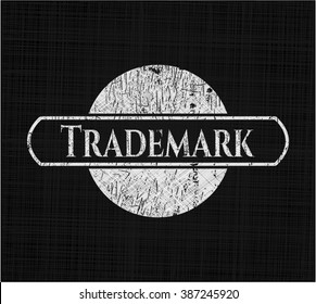 Trademark chalkboard emblem on black board