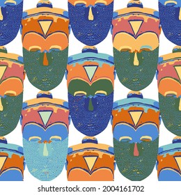 Traditional African culture attributes. Vintage ritual wooden masks. Vector repeated seamless pattern