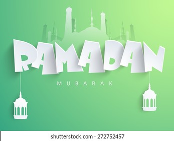 Traditional arabic lamps or lanterns hanging by paper text Ramadan Mubarak on islamic mosque silhouette, shiny green background.