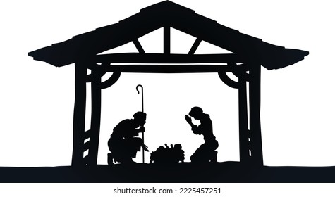 Traditional Christian Christmas Nativity Scene of baby Jesus in the manger with Mary and Joseph in silhouette 