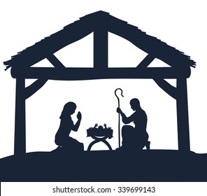 Traditional Christmas Nativity Scene of baby Jesus in the manger with Mary and Joseph in silhouette