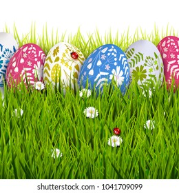 Traditional Easter background with colorful painted Easter eggs in the grass. 