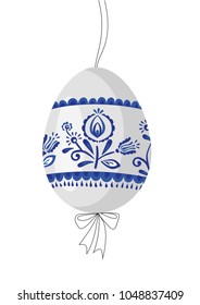 Traditional easter egg with typical pattern and colors with ribbon. Beautifull easter egg with nice colours and ribbon. Tradition easter egg hunt