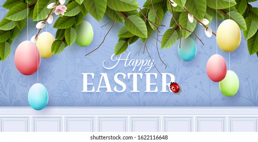 Traditional Easter garland with colorful eggs on blue background.