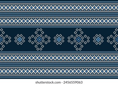 Traditional ethnic motifs ikat geometric fabric pattern cross stitch.Ikat embroidery Ethnic oriental Pixel navy blue background. Abstract,vector,illustration. Texture,decoration,wallpaper.