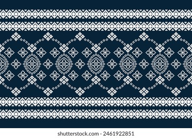 Traditional ethnic motifs ikat geometric fabric pattern cross stitch.Ikat embroidery Ethnic oriental Pixel navy blue background. Abstract,vector,illustration. Texture,decoration,wallpaper.