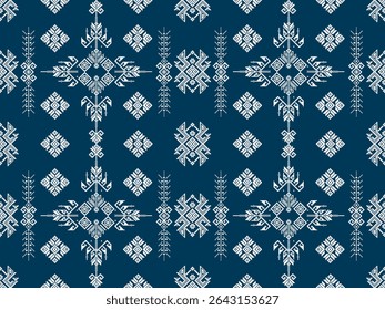 Traditional geometric pattern with intricate white motifs on a dark blue background, inspired by ethnic or folk textile designs.