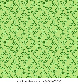 Traditional green celtic style braided knots triquetra symbols seamless pattern. Irish St. Patrick's day vector background.
