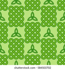 Traditional green celtic style braided knots and triquetra symbol seamless pattern. Irish St. Patrick's day vector background.