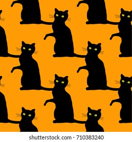 Traditional Halloween seamless pattern with scary black cats over orange background.